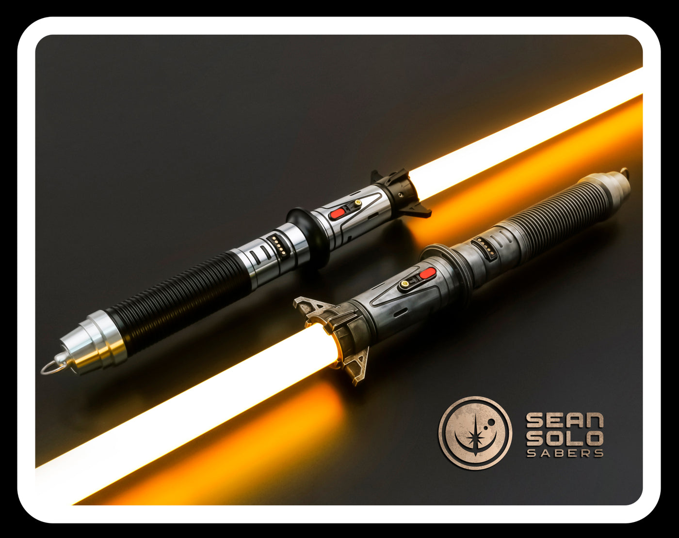 two light sabers sitting next to each other on a table